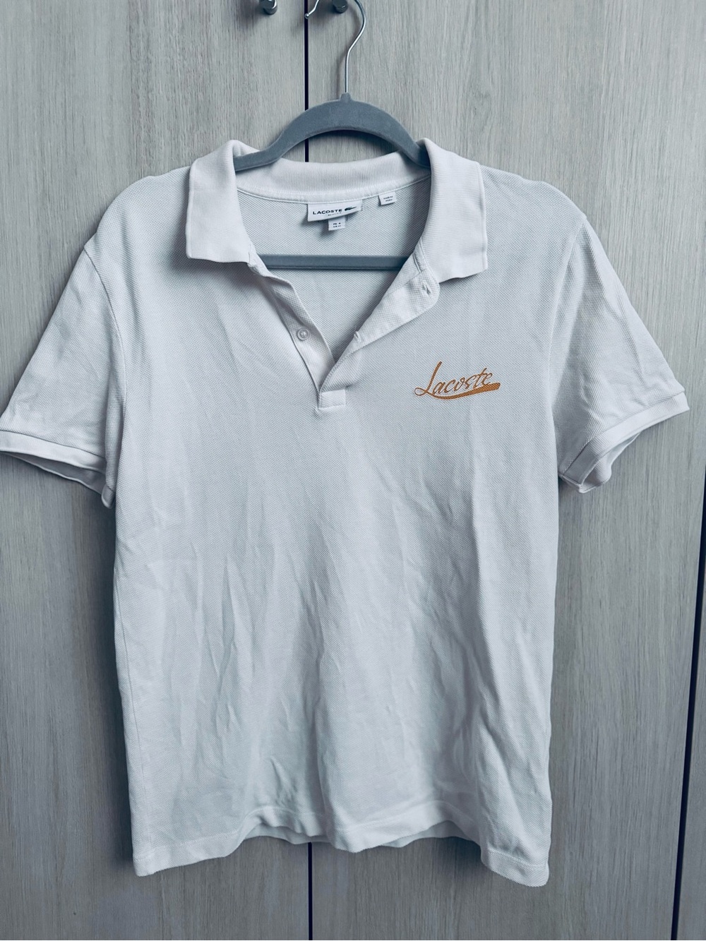 Lacoste White Polo with Tan Script Logo